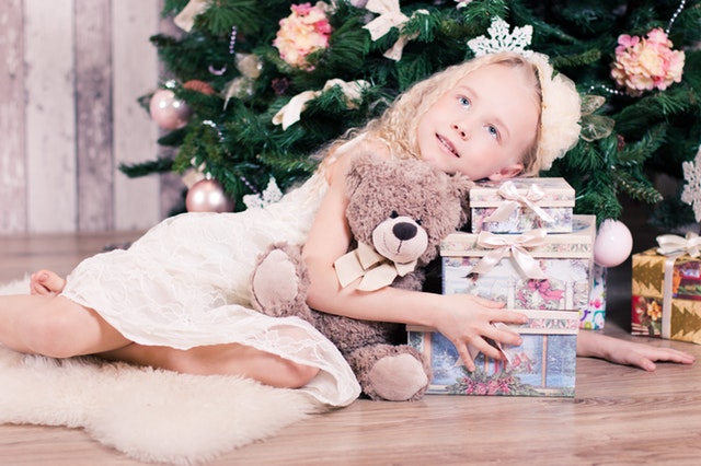 child with Christmas gifts